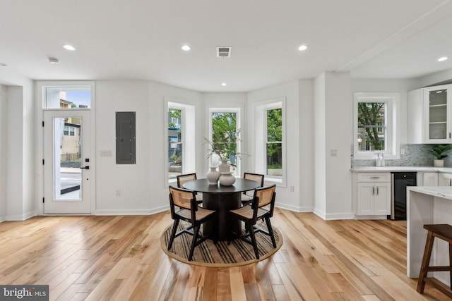 660 Columbia Rd NW, Washington, DC 20001 - dining room with electric panel, light wood-type flooring, plenty of natural light, baseboards, and recessed lighting