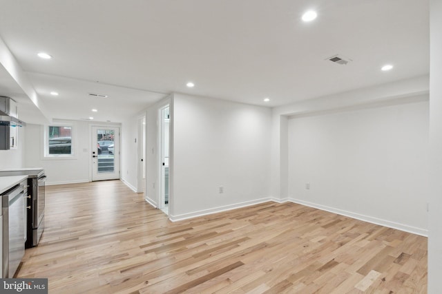 660 Columbia Rd NW, Washington, DC 20001 - unfurnished living room featuring light wood-style flooring, recessed lighting, and baseboards