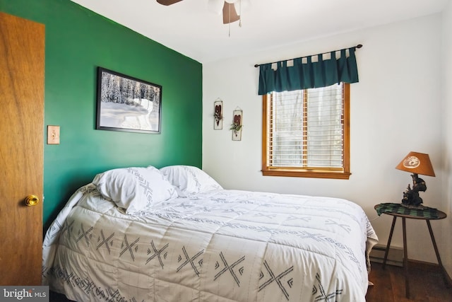 164 Fawn Rd, Pocono Lake, PA 18347 - bedroom featuring ceiling fan, wood finished floors, baseboards, and a baseboard heating unit