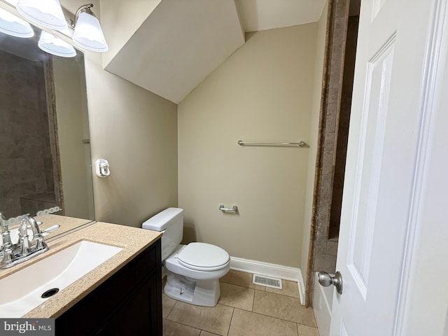 full bath with toilet, tile patterned floors, vanity, and baseboards