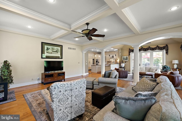 107 Centrenest Ln, Wilmington, DE 19807 - living room featuring ornamental molding, ceiling fan, decorative columns, wood finished floors, and arched walkways