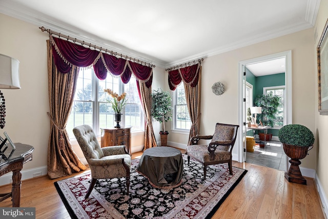 107 Centrenest Ln, Wilmington, DE 19807 - sitting room with crown molding, baseboards, and light wood-type flooring