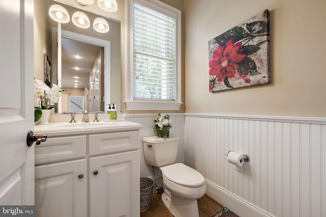 107 Centrenest Ln, Wilmington, DE 19807 - bathroom featuring vanity, toilet, wood finished floors, and wainscoting