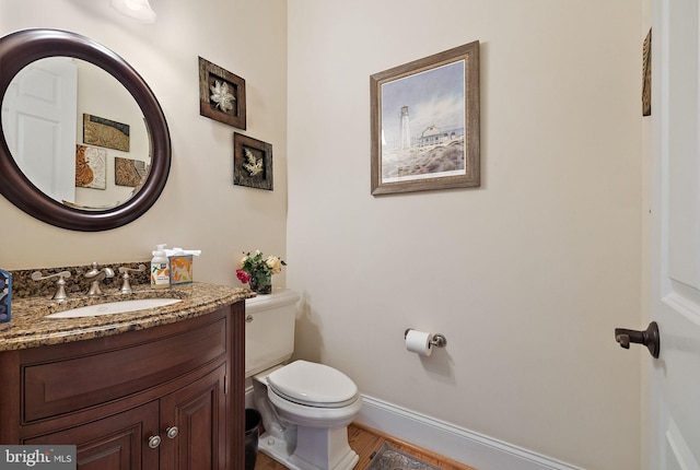 107 Centrenest Ln, Wilmington, DE 19807 - half bathroom featuring toilet, baseboards, vanity, and wood finished floors