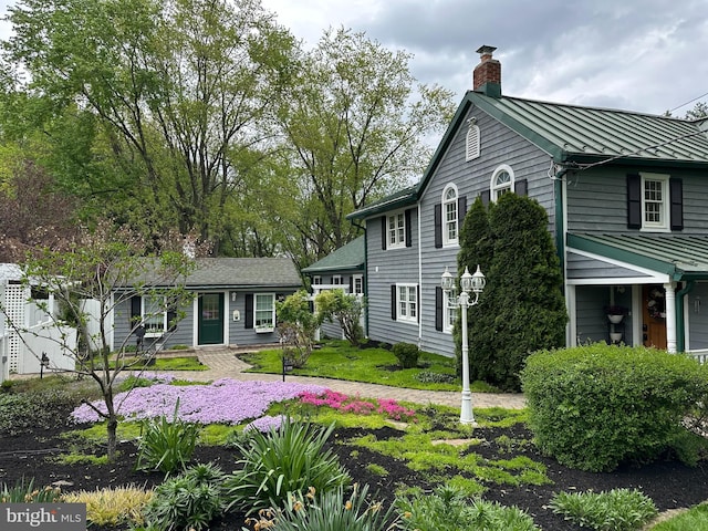 832 Muller Rd, Westminster, MD 21157 - view of front of house with a standing seam roof, a chimney, and metal roof