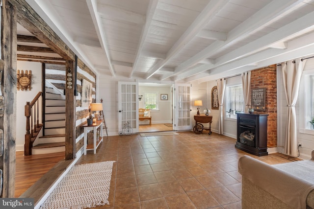 832 Muller Rd, Westminster, MD 21157 - tiled entrance foyer featuring beamed ceiling, baseboards, stairway, a wood stove, and french doors