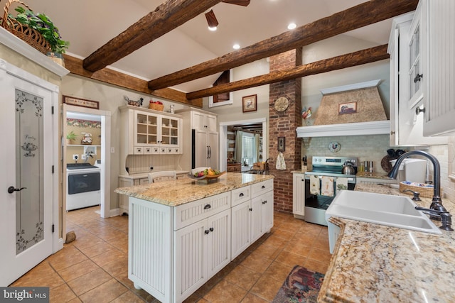 832 Muller Rd, Westminster, MD 21157 - kitchen featuring stainless steel electric range, washer / dryer, light tile patterned flooring, built in refrigerator, and recessed lighting