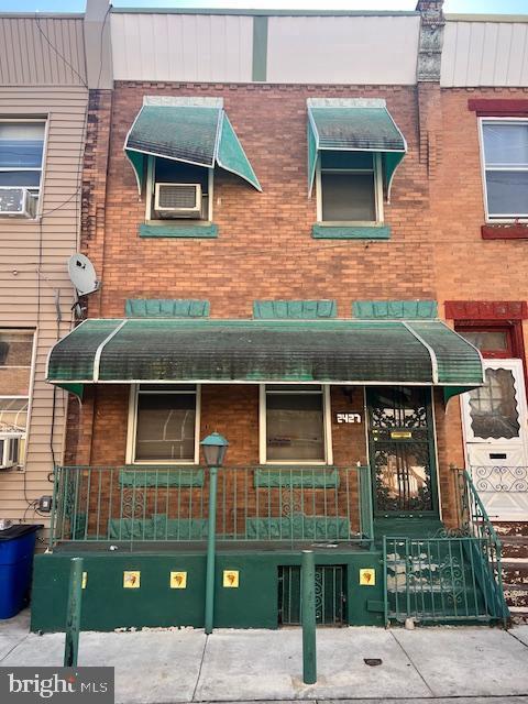 2427 N Hollywood St, Philadelphia, PA 19132 - view of front of property featuring cooling unit and brick siding