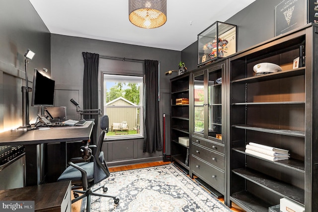 home office with wood finished floors