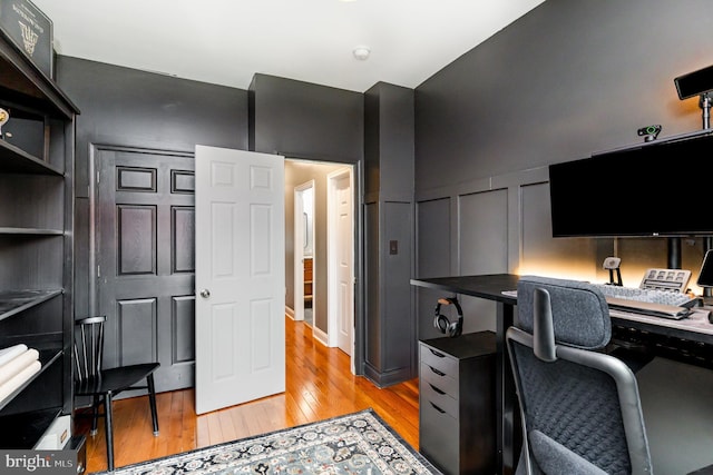 office with light wood-style flooring