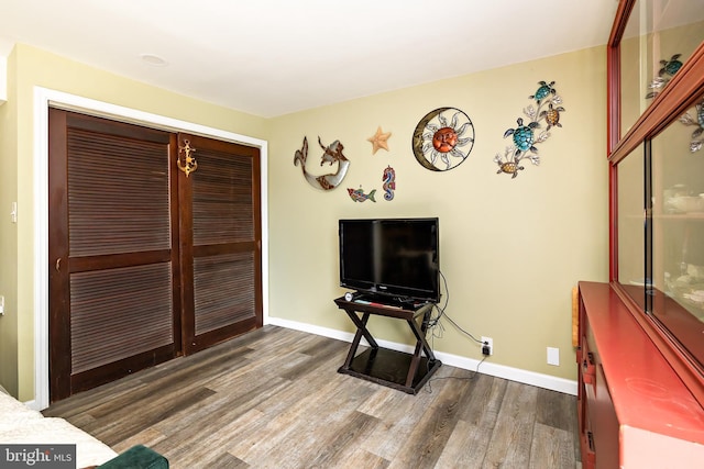 playroom with wood finished floors and baseboards
