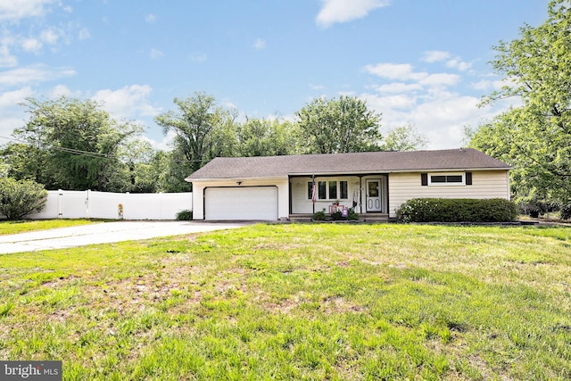 ranch-style home featuring a garage, concrete driveway, and covered porch