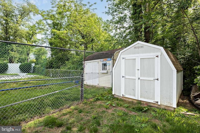 view of shed with fence