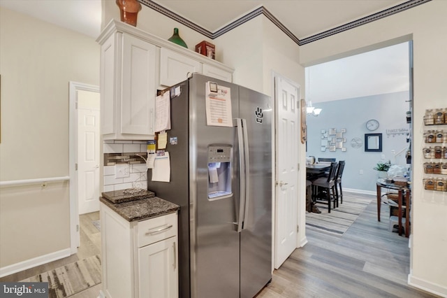 3114 Harmony Rose Ct, Dover, PA 17315 - kitchen with stainless steel fridge with ice dispenser, light wood-style floors, white cabinets, backsplash, and ornamental molding
