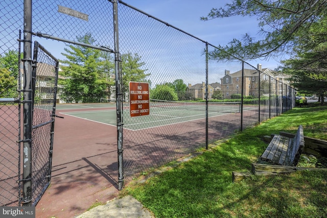 view of sport court with fence