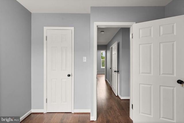 3011 W Lanvale St, Baltimore, MD 21216 - hall with dark wood-style floors and baseboards