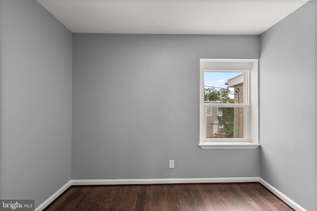 3011 W Lanvale St, Baltimore, MD 21216 - empty room with baseboards and dark wood-style floors