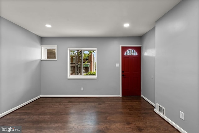 entryway with recessed lighting, baseboards, and wood finished floors