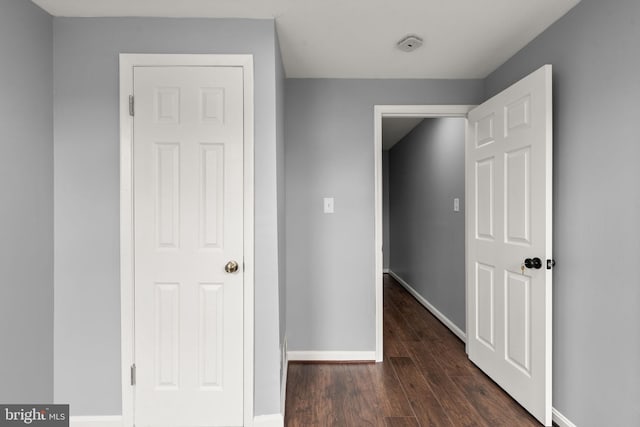 3011 W Lanvale St, Baltimore, MD 21216 - corridor with dark wood-type flooring and baseboards