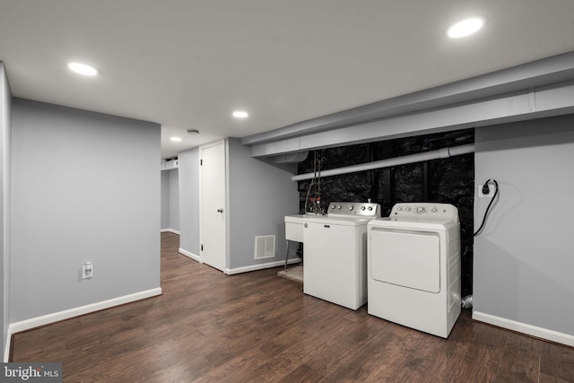 3011 W Lanvale St, Baltimore, MD 21216 - clothes washing area with washing machine and clothes dryer, baseboards, dark wood-style flooring, and recessed lighting
