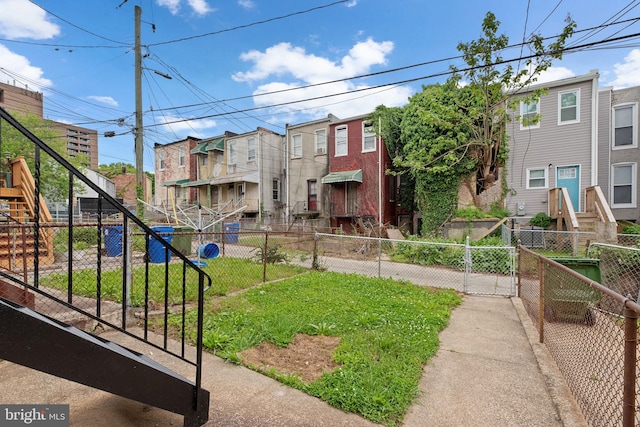 view of community with fence and a residential view