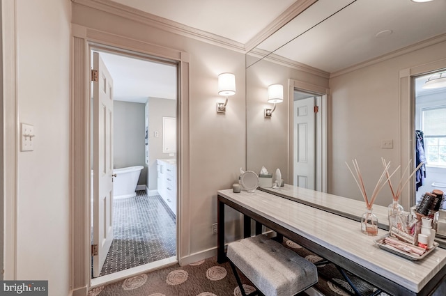 bathroom featuring crown molding, baseboards, and vanity