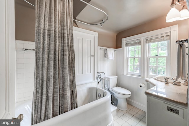 full bathroom featuring vanity, shower / bathtub combination with curtain, tile patterned flooring, and toilet