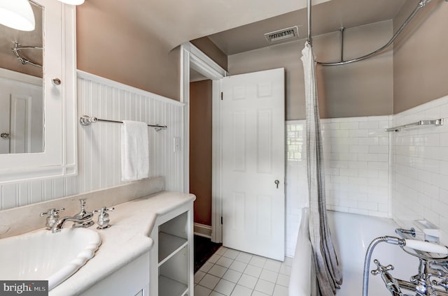 full bath with tile patterned floors, vanity, and visible vents