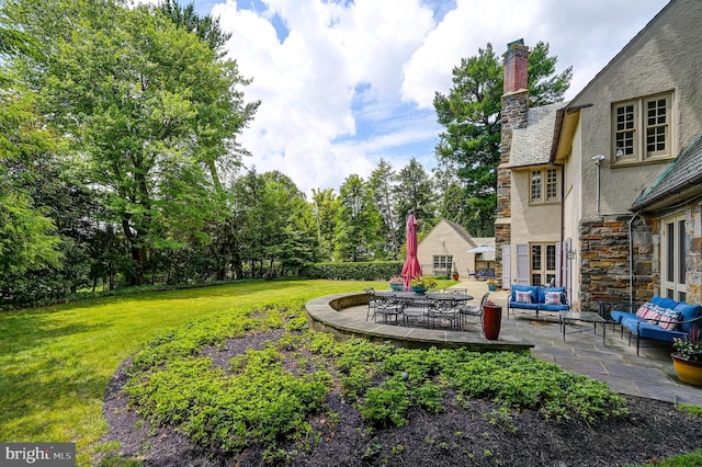 view of yard with a patio area and an outdoor living space