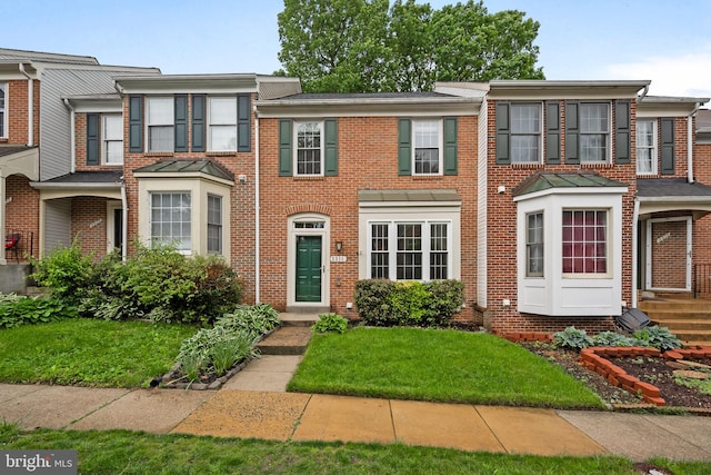 view of property with brick siding