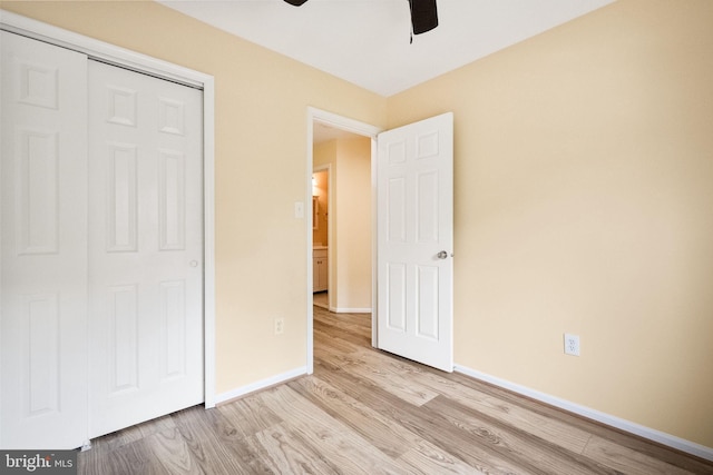 unfurnished bedroom featuring baseboards, ceiling fan, and wood finished floors