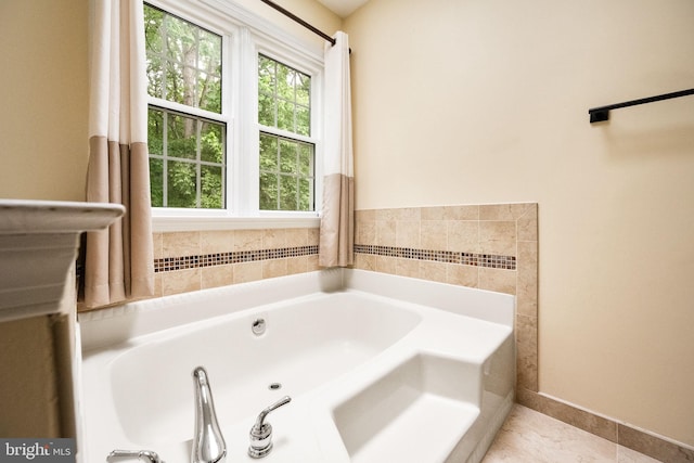 full bath with tile patterned floors and a garden tub