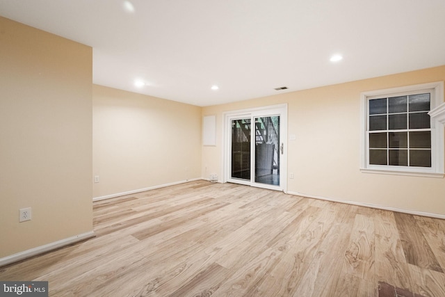 unfurnished room with recessed lighting, baseboards, visible vents, and wood finished floors