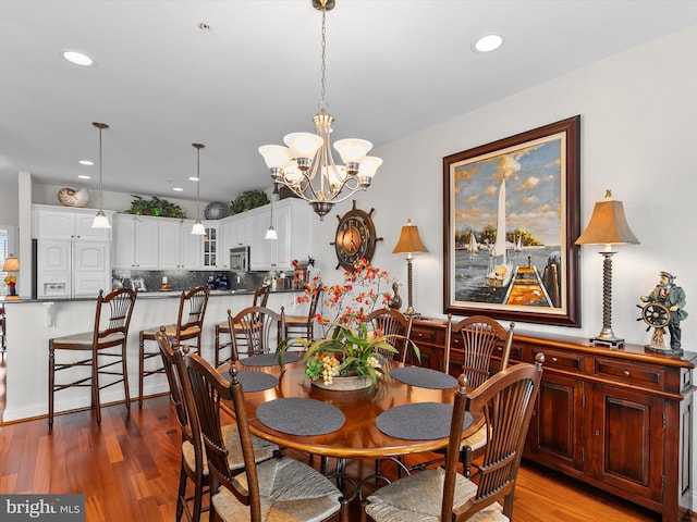13000 Marina View Ln Unit 25, Ocean City, MD 21842 - dining room featuring wood finished floors, recessed lighting, and a chandelier