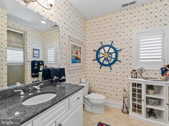 13000 Marina View Ln Unit 25, Ocean City, MD 21842 - bathroom featuring tile patterned floors, toilet, vanity, wallpapered walls, and baseboards