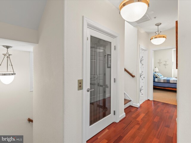 13000 Marina View Ln Unit 25, Ocean City, MD 21842 - corridor featuring dark wood-style floors and stairs