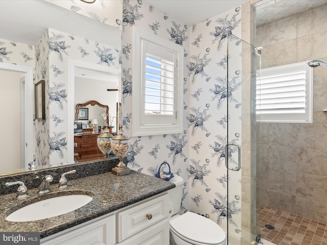 13000 Marina View Ln Unit 25, Ocean City, MD 21842 - bathroom with wallpapered walls, a shower stall, toilet, and vanity