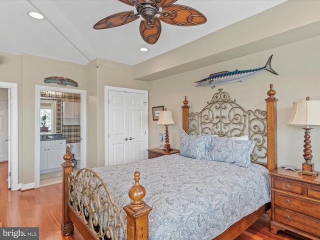 13000 Marina View Ln Unit 25, Ocean City, MD 21842 - bedroom with light wood-style flooring, a closet, ensuite bathroom, recessed lighting, and a ceiling fan