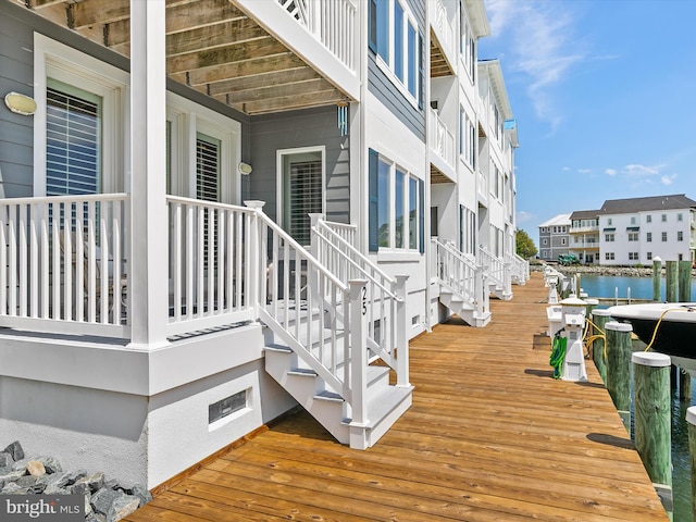 13000 Marina View Ln Unit 25, Ocean City, MD 21842 - deck featuring stairway and a boat dock