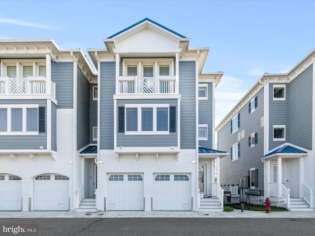 13000 Marina View Ln Unit 25, Ocean City, MD 21842 - multi unit property with a garage, a balcony, metal roof, and a standing seam roof
