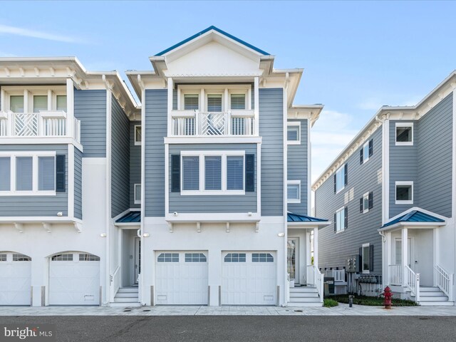 13000 Marina View Ln Unit 25, Ocean City, MD 21842 - multi unit property with a garage, a balcony, metal roof, and a standing seam roof