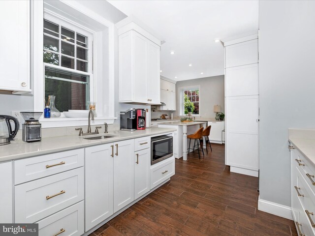 11 Linden Ave, Mercersburg, PA 17236 - kitchen with a sink, stainless steel microwave, white cabinetry, dark wood finished floors, and recessed lighting