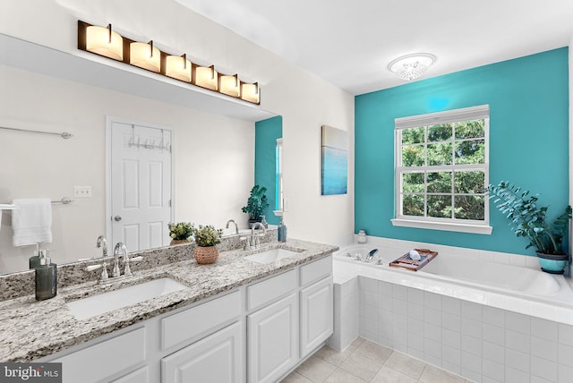 full bath with a bath, tile patterned floors, and double vanity