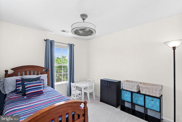 bedroom with carpet floors and baseboards