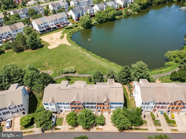 aerial perspective of suburban area featuring a large body of water