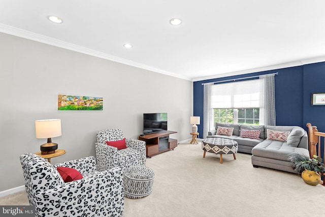 carpeted living area with crown molding, baseboards, and recessed lighting