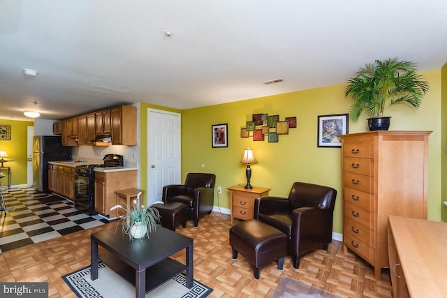living room with light flooring and baseboards