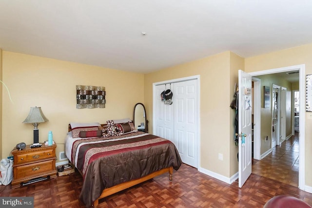 bedroom with a closet and baseboards