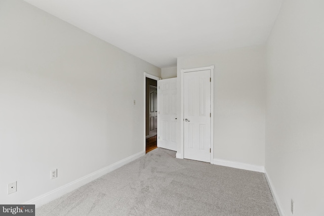 12473 Turtle Dove Pl, Waldorf, MD 20602 - unfurnished bedroom with carpet flooring, baseboards, and a closet
