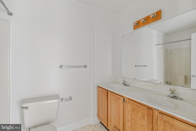 12473 Turtle Dove Pl, Waldorf, MD 20602 - full bathroom featuring toilet, double vanity, baseboards, and a shower